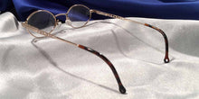 Load image into Gallery viewer, Back view of Princess of Ireland gold metal and tortoiseshell eyeglasses
