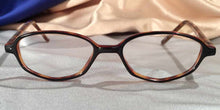Load image into Gallery viewer, Front view of Rara Avis tortoiseshell angular oval eyeglasses
