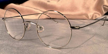 Load image into Gallery viewer, Side view of Signature Metal Rounds silver eyeglasses
