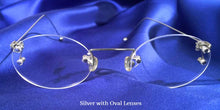 Load image into Gallery viewer, Front view of Signature Rimless silver eyeglasses with oval lenses
