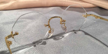 Load image into Gallery viewer, Back view of Traditionals Rimless gold metal eyeglasses with octagon lenses
