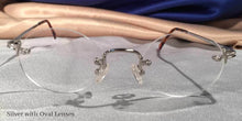 Load image into Gallery viewer, Front view of Traditionals Rimless silver metal eyeglasses with oblong lenses
