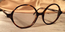 Load image into Gallery viewer, Side view of Bicycles round tortoise shell eyeglasses
