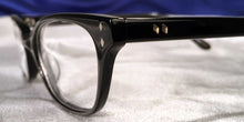 Load image into Gallery viewer, Detail view of Bull Markets glossy black rectangular eyeglasses
