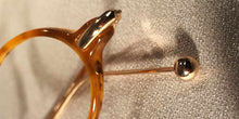 Load image into Gallery viewer, Detail view of Capistranos tortoise shell and gold oval eyeglasses
