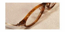 Load image into Gallery viewer, Top view of Capistranos tortoise shell and gold oval eyeglasses
