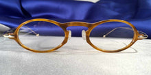 Load image into Gallery viewer, Front view of Capistranos tortoise shell and gold oval eyeglasses
