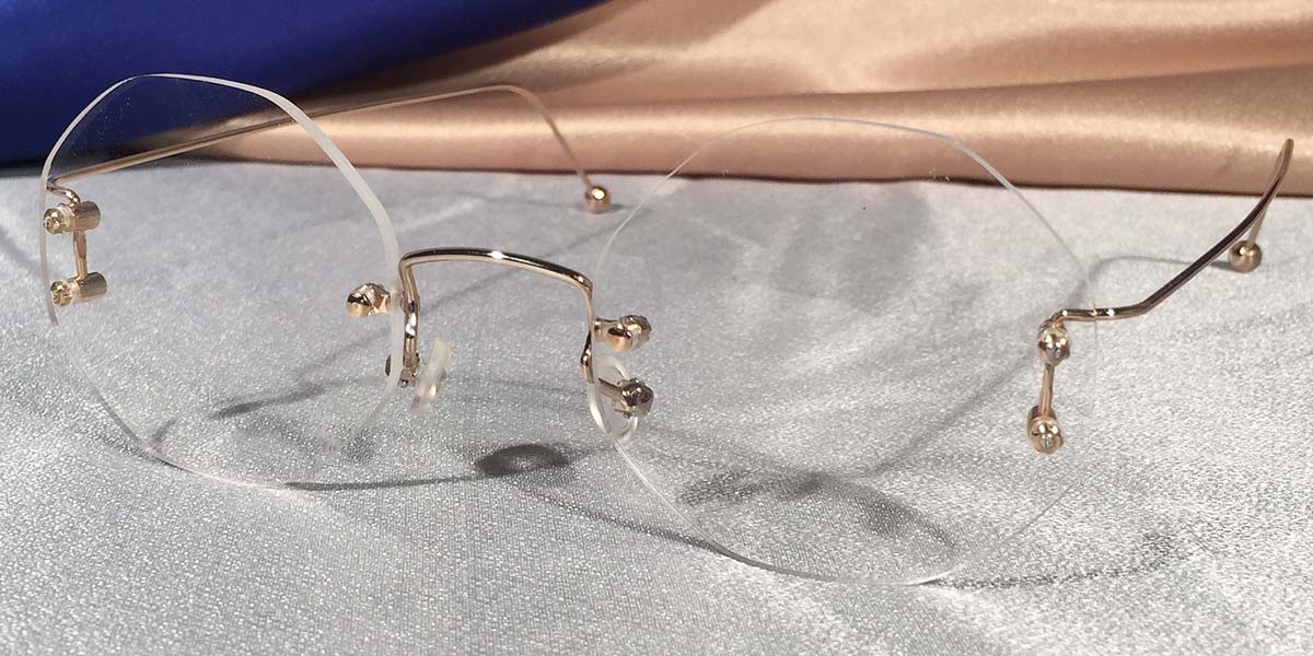 Side view of Duolettes gold rimless eyeglasses with octagon lenses