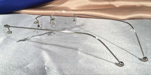 Load image into Gallery viewer, Back view of Duolettes silver rimless eyeglasses with oval lenses
