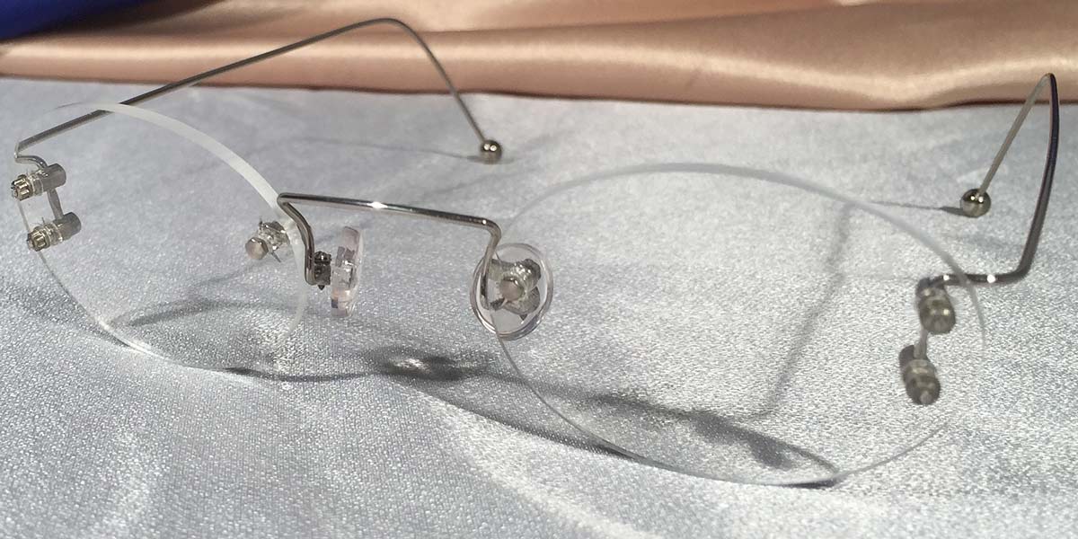 Front view of Duolettes silver rimless eyeglasses with oval lenses