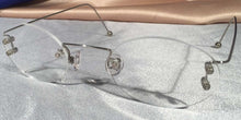 Load image into Gallery viewer, Front view of Duolettes silver rimless eyeglasses with oval lenses
