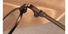 Load image into Gallery viewer, Detail view of Erudites gold pewter metal eyeglasses
