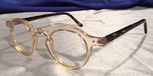 Load image into Gallery viewer, Side view of Hubbles tortoiseshell frames with clear wheat color rimmed eyeglasses
