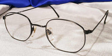 Load image into Gallery viewer, Corner view of Masters matte black metal eyeglasses
