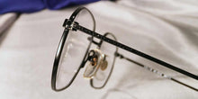 Load image into Gallery viewer, Side view of Masters matte black metal eyeglasses
