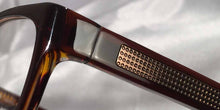 Load image into Gallery viewer, Detail view of Persuaders amber brown rectangular eyeglasses
