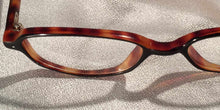 Load image into Gallery viewer, Detail view of Rara Avis tortoiseshell angular oval eyeglasses
